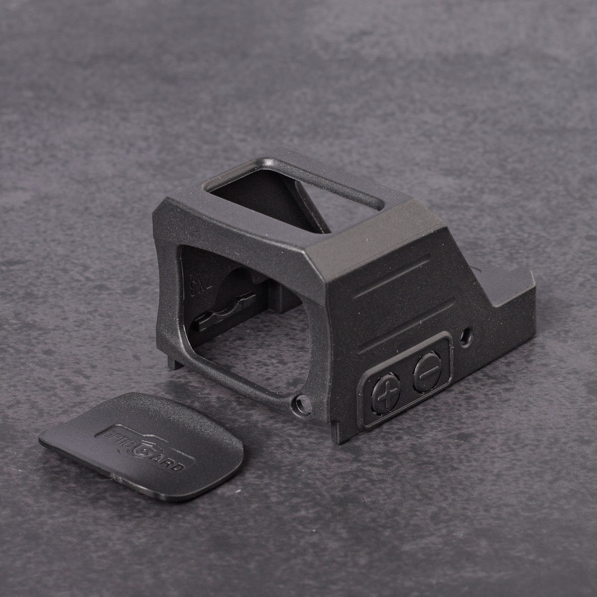 Black OpticGard Cover for Holosun 507CX3 on a gray textured background